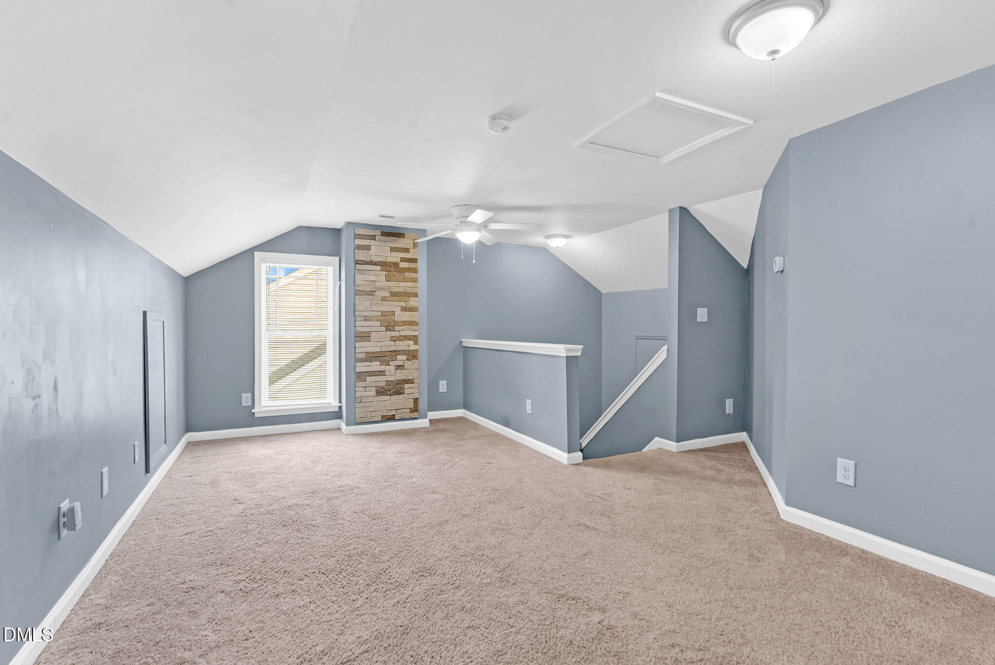5512 Grand Traverse Drive Raleigh, NC 27604 - Photo 40 of 62 a view of an empty room with window and stairs