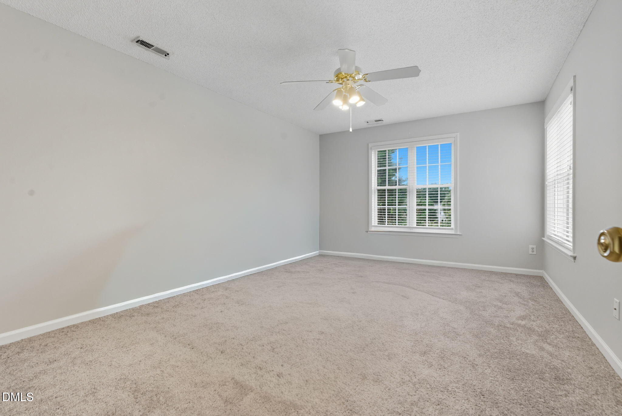 5512 Grand Traverse Drive Raleigh, NC 27604 - Photo 4 of 62 a view of an empty room with a window