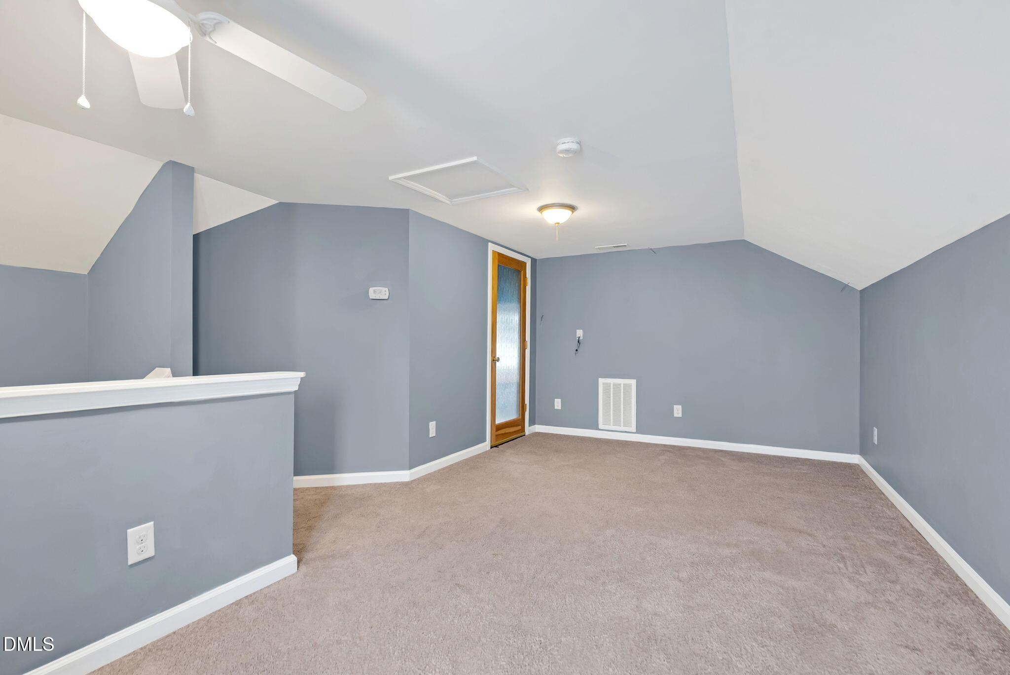 5512 Grand Traverse Drive Raleigh, NC 27604 - Photo 41 of 62 a view of a livingroom with a ceiling fan