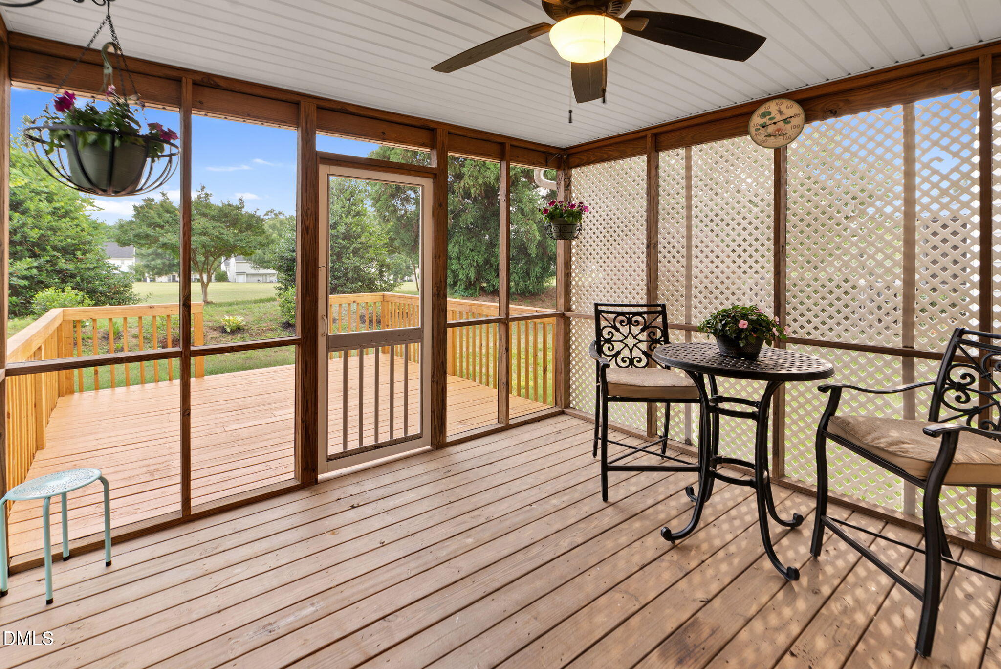 5512 Grand Traverse Drive Raleigh, NC 27604 - Photo 42 of 62 a view of a porch with furniture and wooden floor