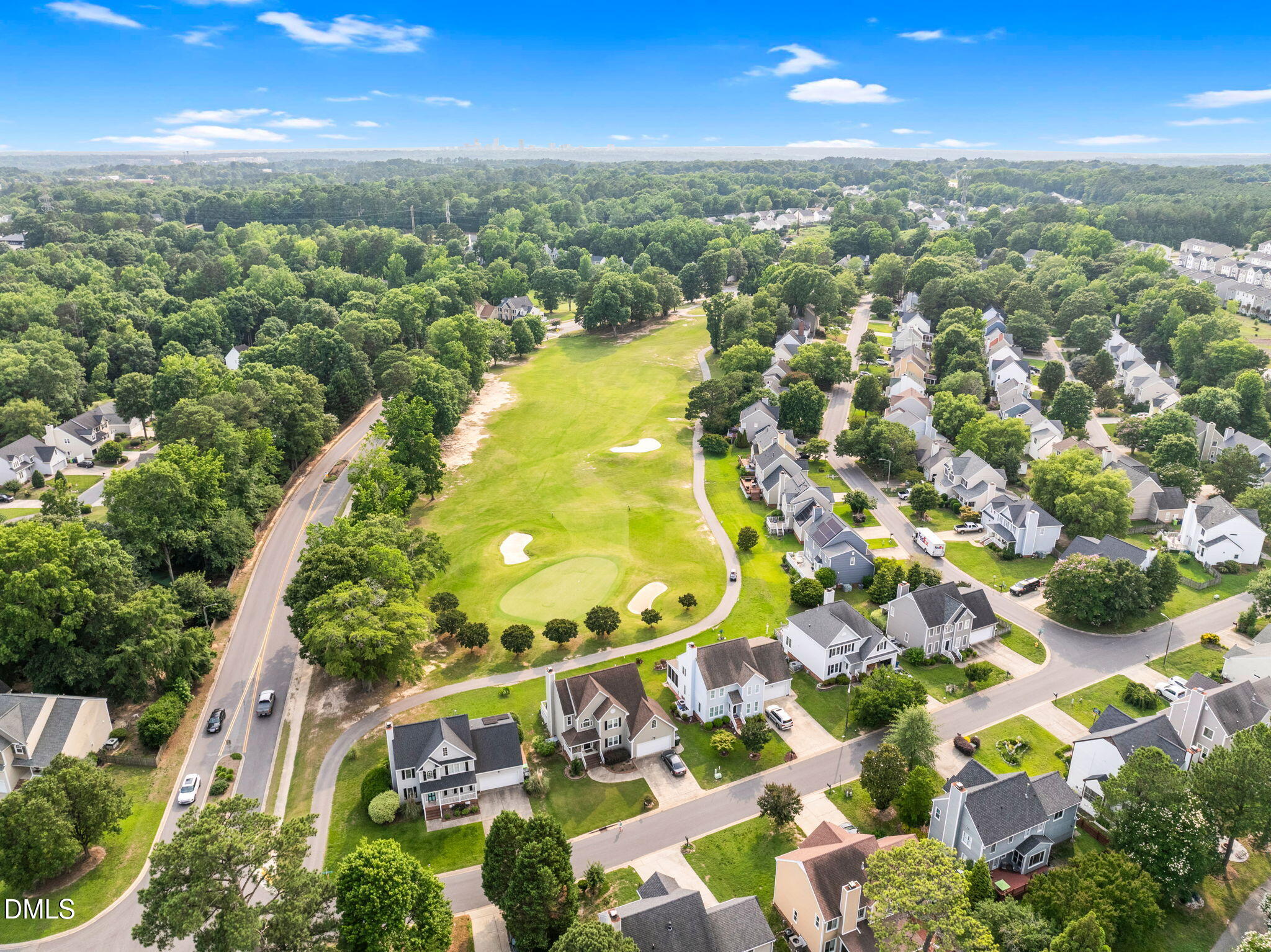 5512 Grand Traverse Drive Raleigh, NC 27604 - Photo 58 of 62 an aerial view of residential houses with outdoor space and trees