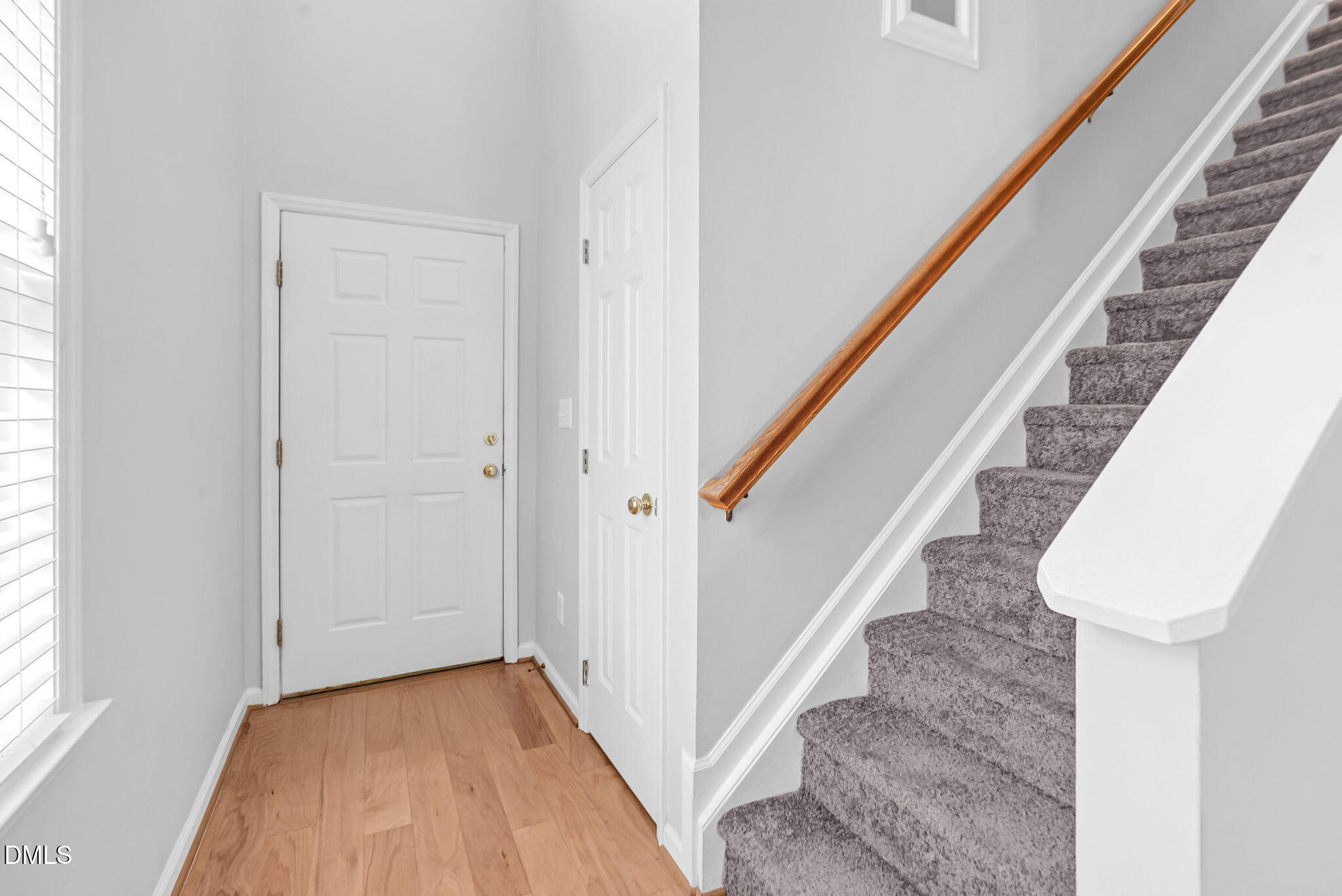 5512 Grand Traverse Drive Raleigh, NC 27604 - Photo 8 of 62 a view of a hallway with wooden floor and staircase