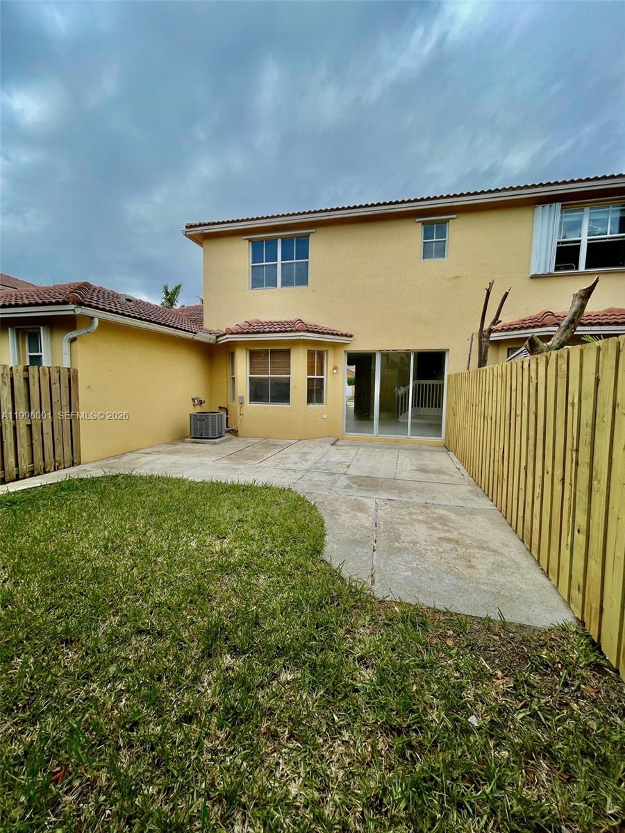24651 Southwest 110th Avenue Homestead, FL 33032 - Photo 13 of 26 a view of a house with a yard