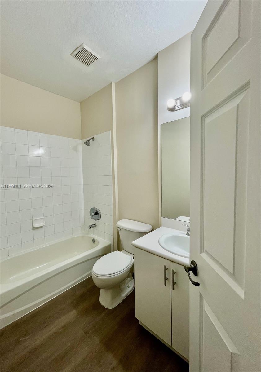24651 Southwest 110th Avenue Homestead, FL 33032 - Photo 19 of 26 a bathroom with a sink a toilet and shower