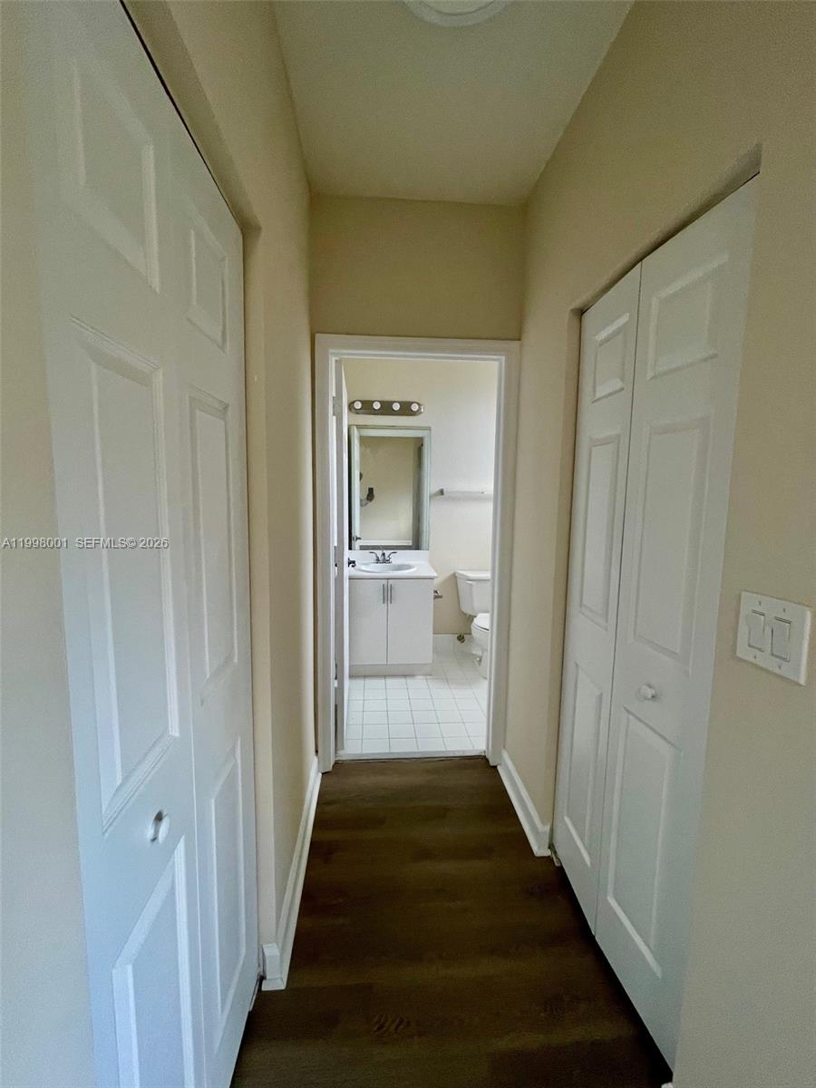 24651 Southwest 110th Avenue Homestead, FL 33032 - Photo 21 of 26 a view of a hallway with a livingroom and a bathroom
