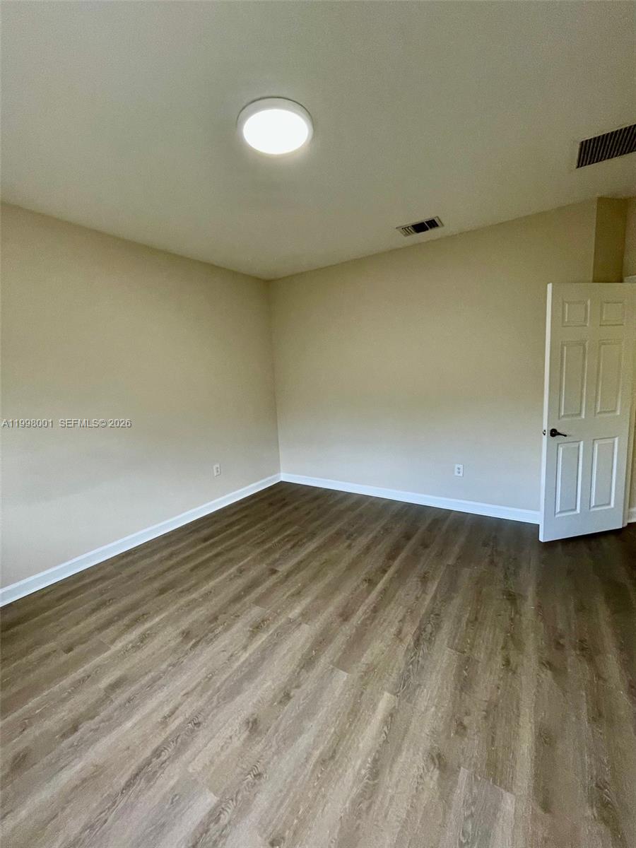 24651 Southwest 110th Avenue Homestead, FL 33032 - Photo 23 of 26 wooden floor in a room