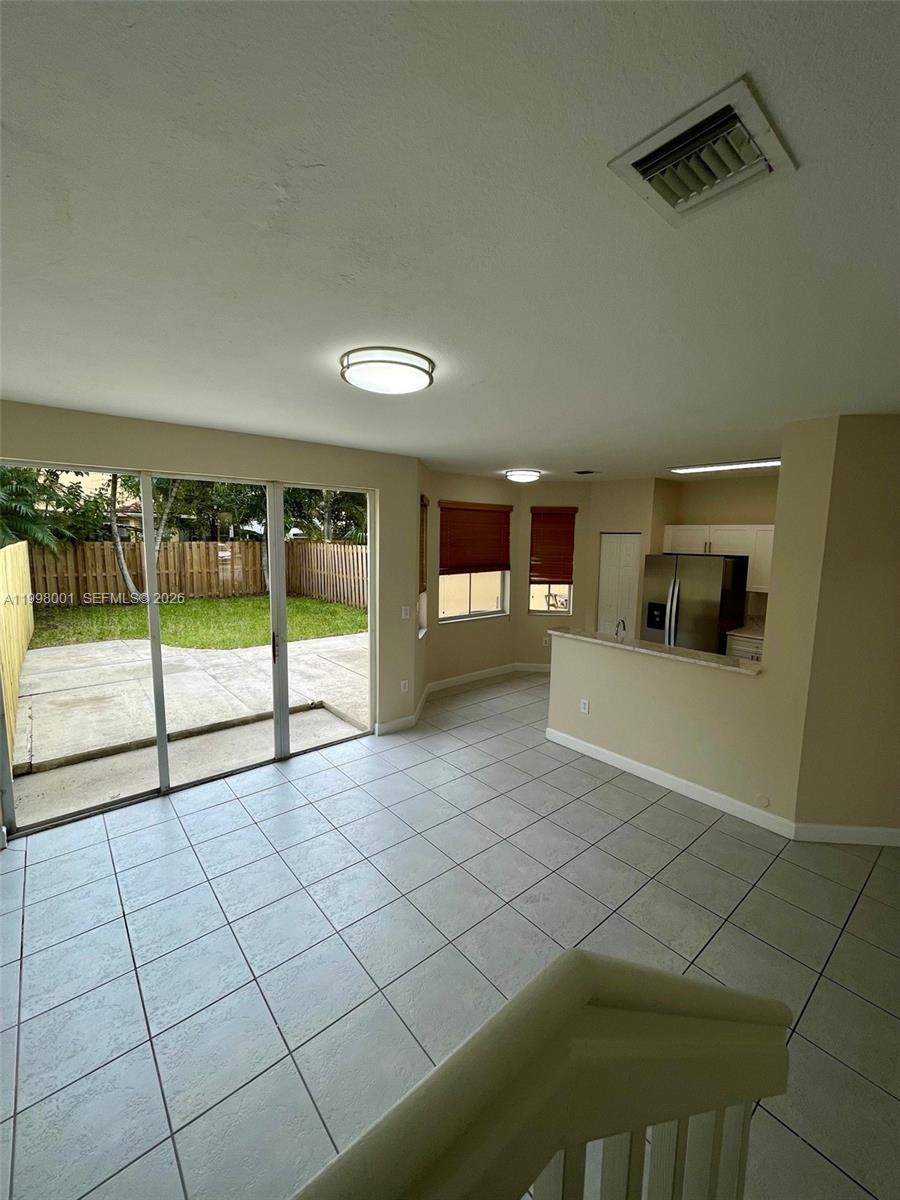 24651 Southwest 110th Avenue Homestead, FL 33032 - Photo 26 of 26 a view of a livingroom and an empty room