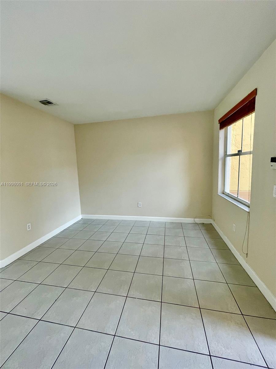 24651 Southwest 110th Avenue Homestead, FL 33032 - Photo 4 of 26 a view of an empty room and window