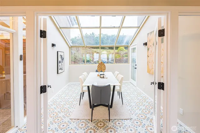 a dining room with furniture and window