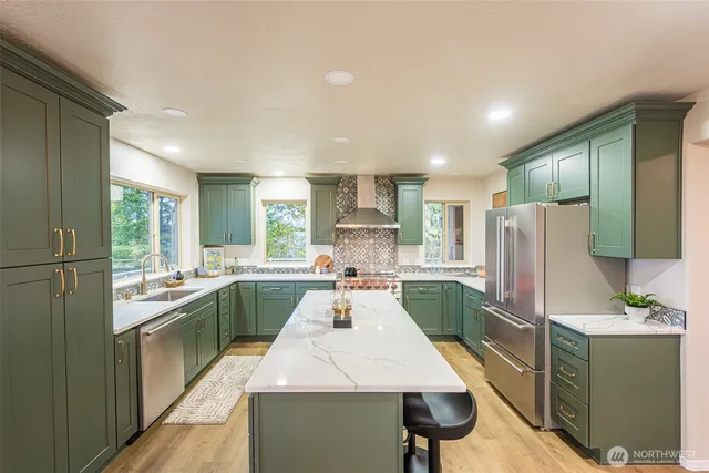 a kitchen with a sink stove and refrigerator