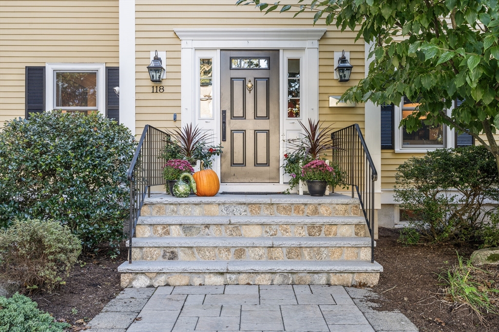 118 Sylvan Road Needham, MA 02492 - Photo 3 of 38 a view of a house with potted plants and a fountain