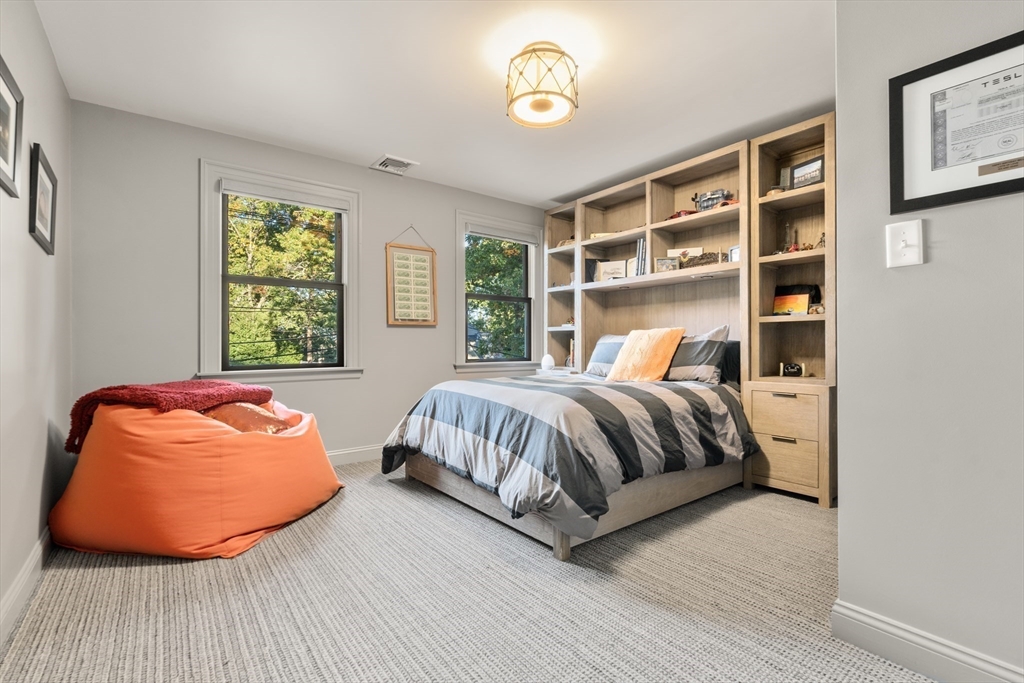 118 Sylvan Road Needham, MA 02492 - Photo 36 of 38 a bedroom with a bed and window