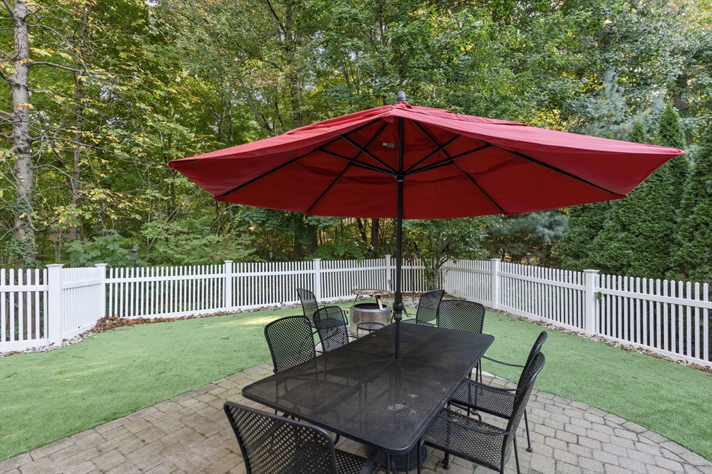 118 Sylvan Road Needham, MA 02492 - Photo 8 of 38 a view of a deck with furniture and a yard