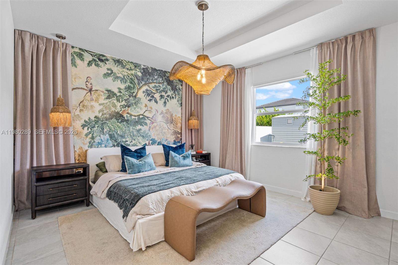 12731 Southwest 213th Street Miami, FL 33177 - Photo 18 of 41 a spacious bedroom with a bed and a window