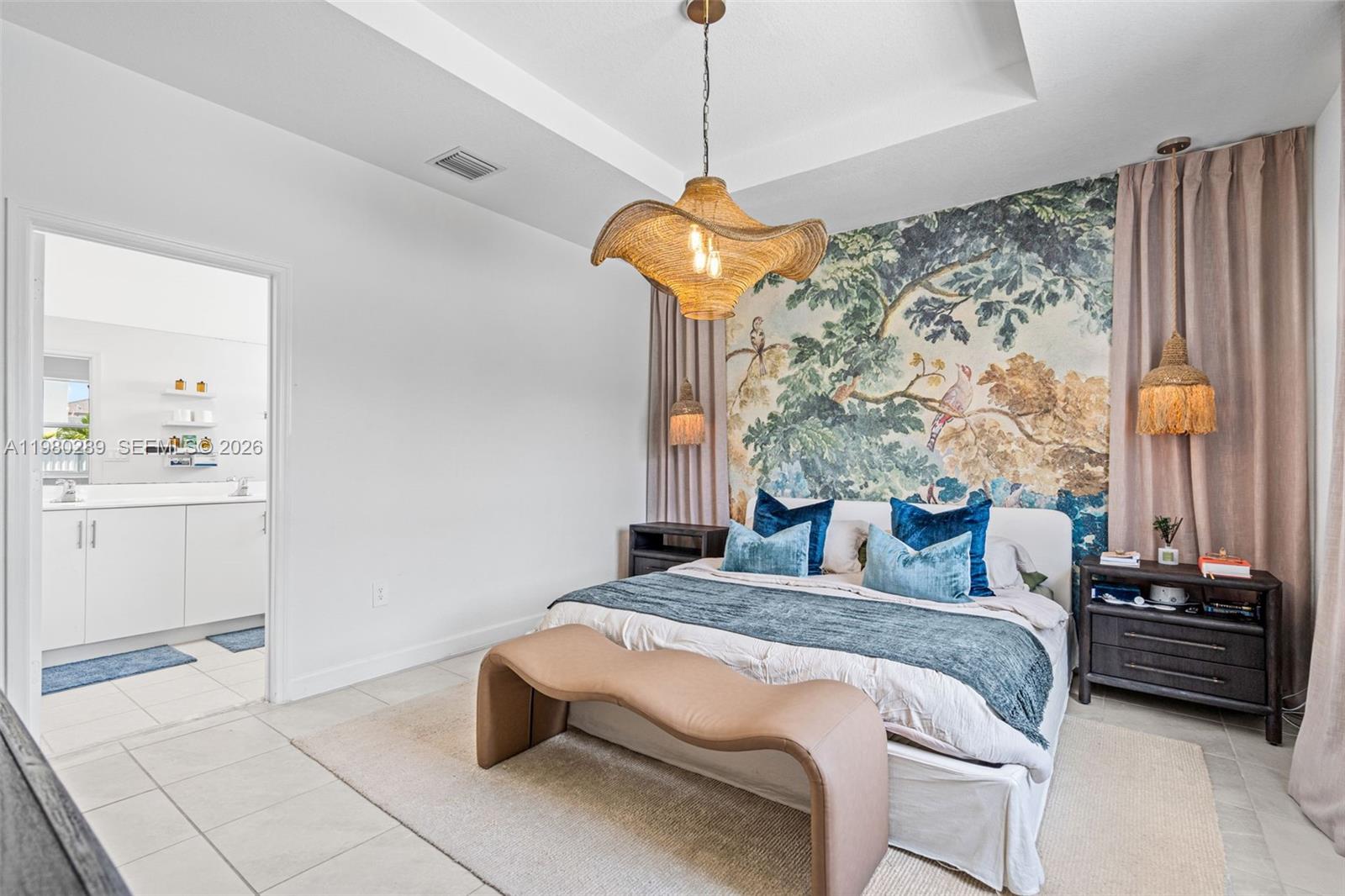 12731 Southwest 213th Street Miami, FL 33177 - Photo 19 of 41 a bedroom with a bed and a chandelier