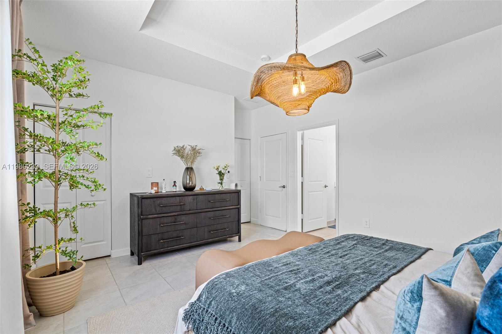 12731 Southwest 213th Street Miami, FL 33177 - Photo 20 of 41 a bed room with a bed and ceiling fan