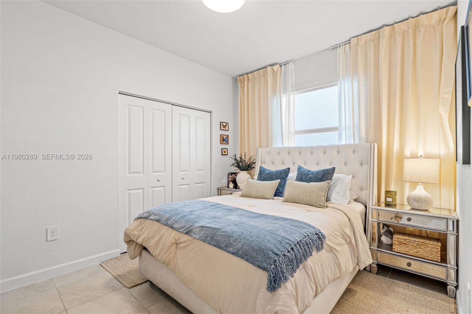 12731 Southwest 213th Street Miami, FL 33177 - Photo 24 of 41 a bedroom with a bed and a window