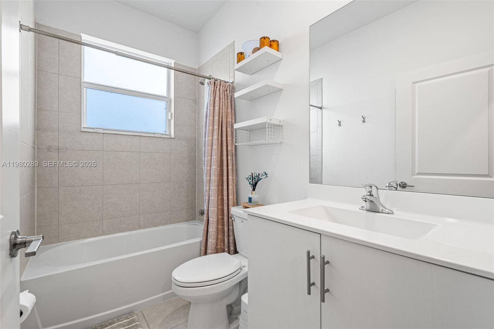 12731 Southwest 213th Street Miami, FL 33177 - Photo 26 of 41 a bathroom with a sink toilet and shower