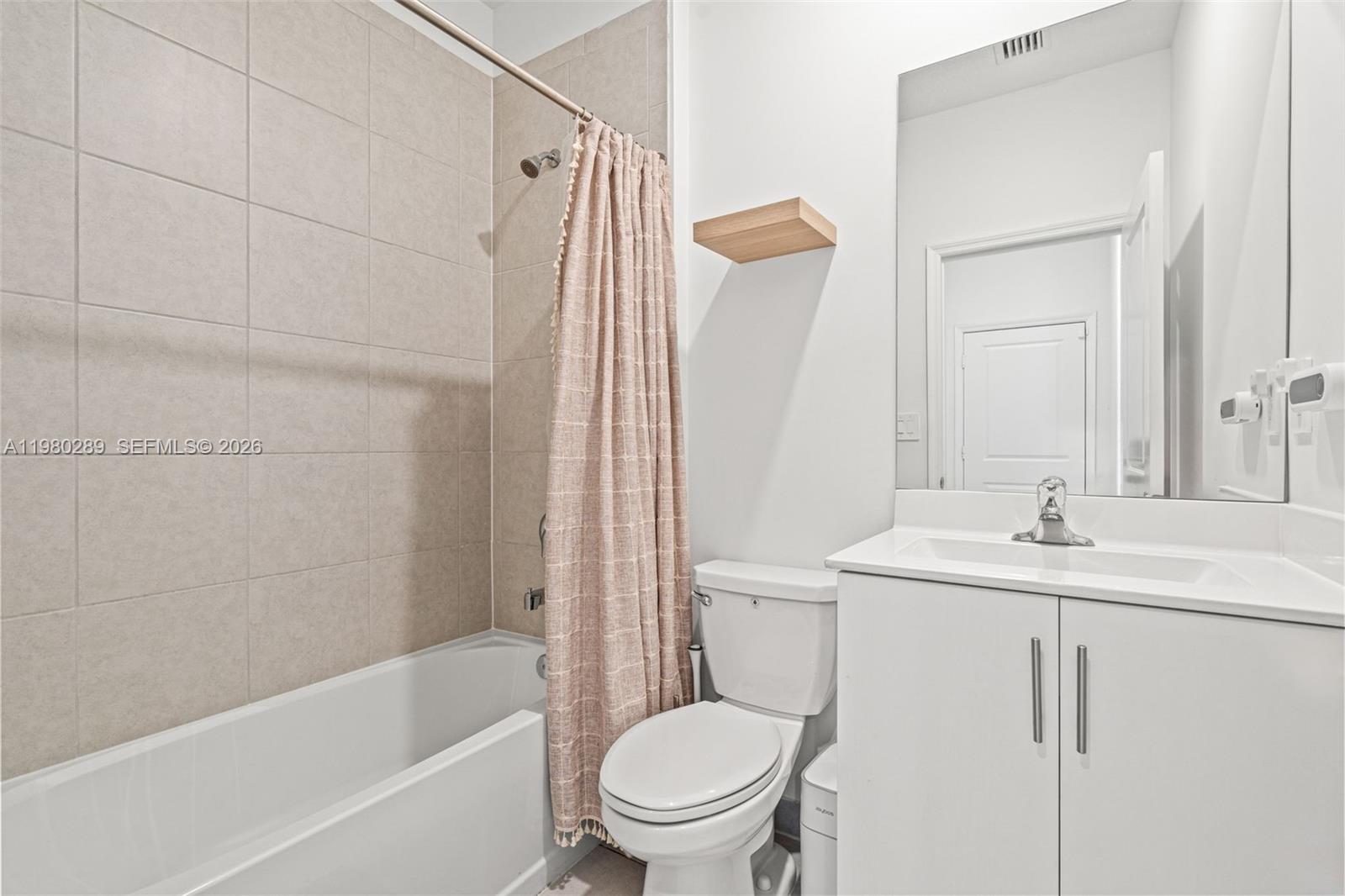 12731 Southwest 213th Street Miami, FL 33177 - Photo 29 of 41 a bathroom with a sink a toilet and shower