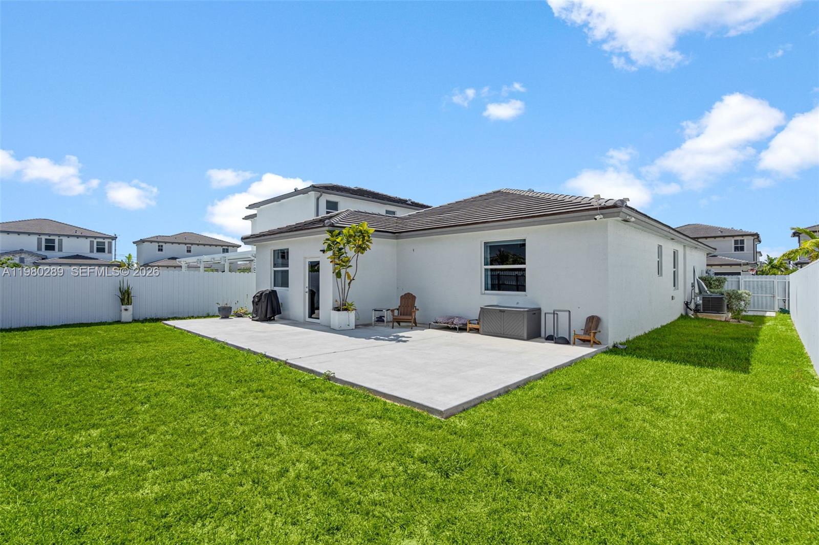 12731 Southwest 213th Street Miami, FL 33177 - Photo 36 of 41 a view of a house with backyard and sitting area