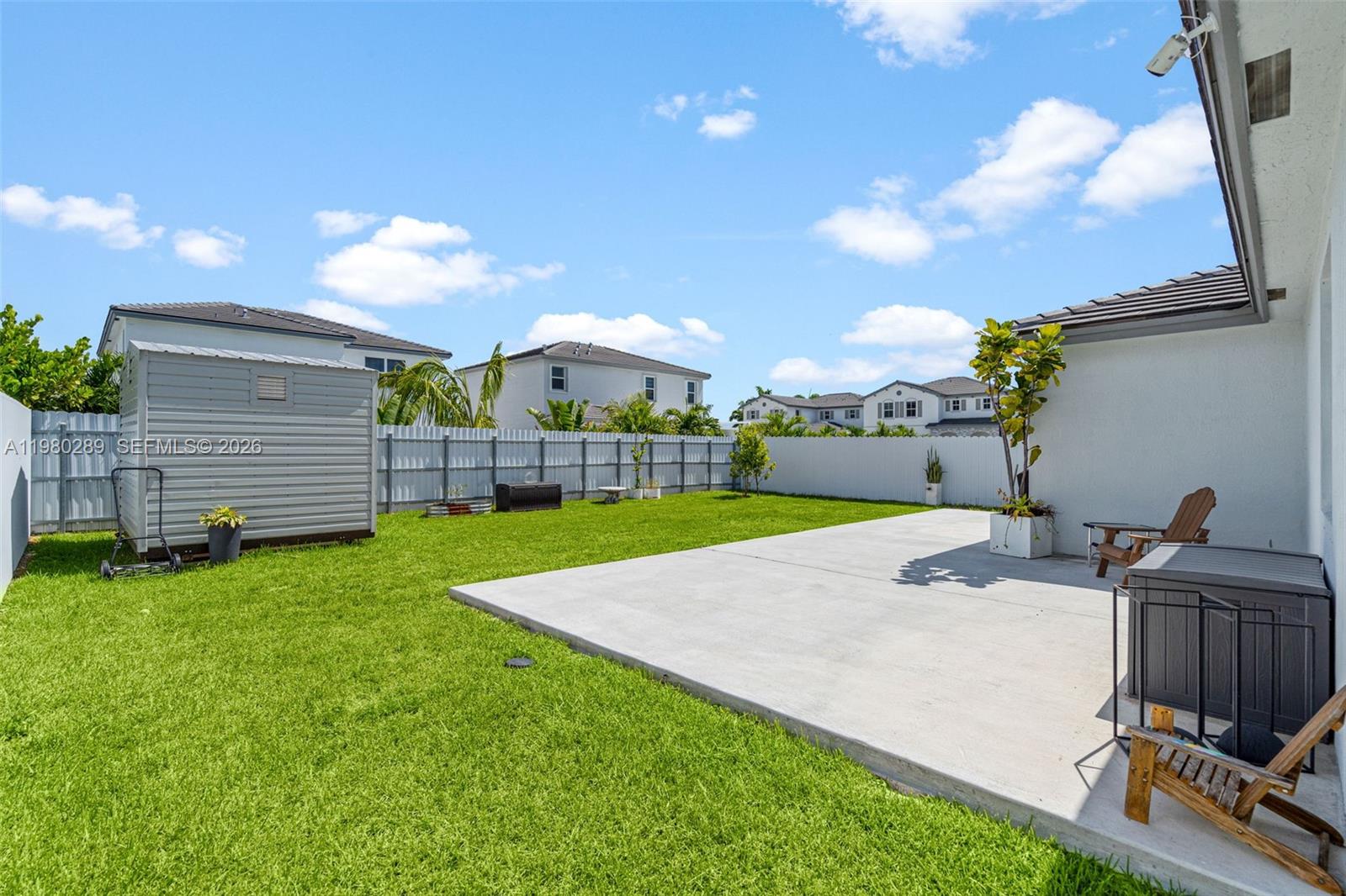12731 Southwest 213th Street Miami, FL 33177 - Photo 38 of 41 a view of a backyard with sitting area