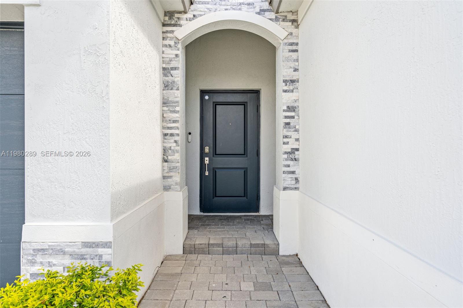 12731 Southwest 213th Street Miami, FL 33177 - Photo 4 of 41 a view of a hallway with entryway