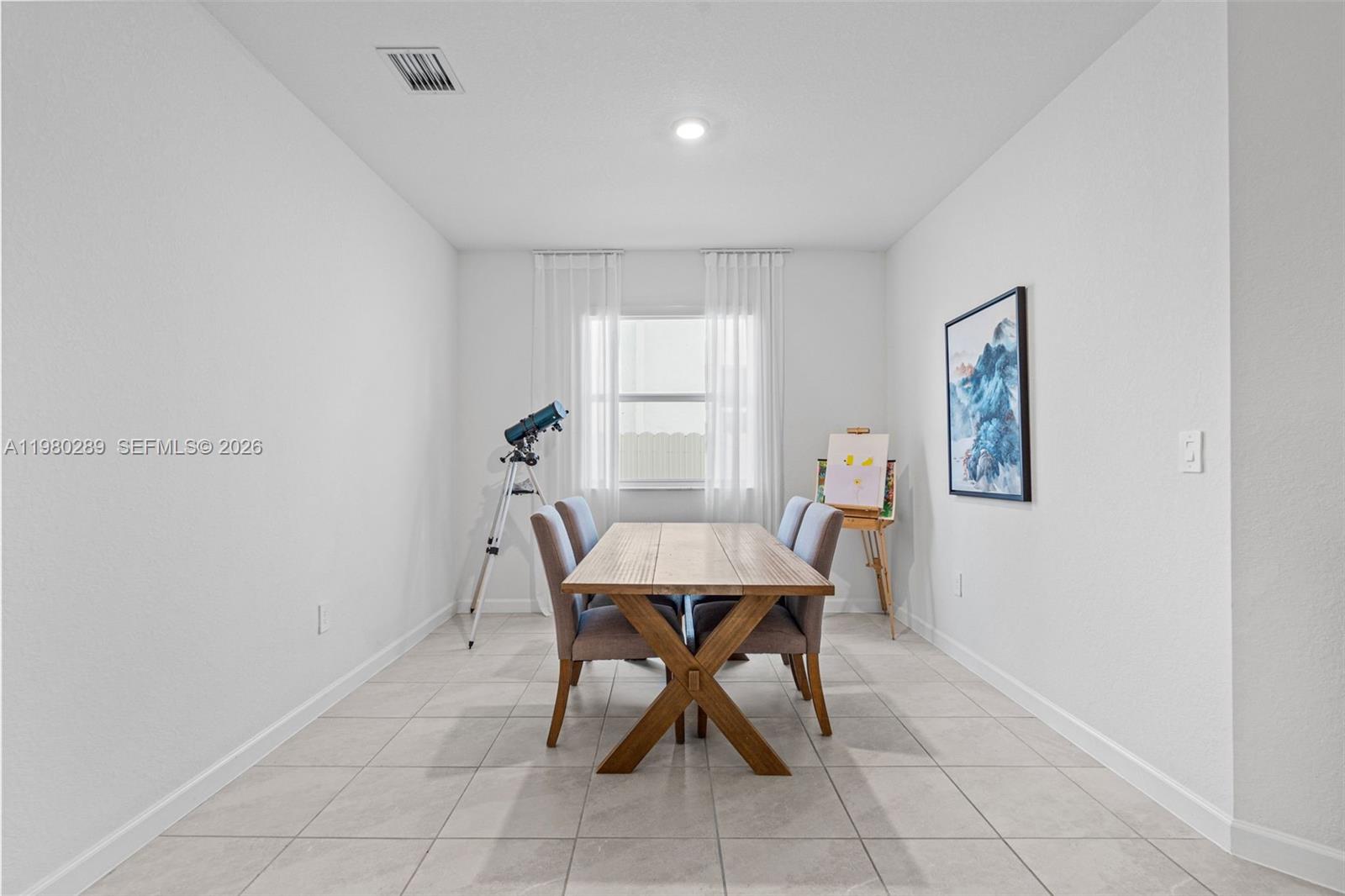 12731 Southwest 213th Street Miami, FL 33177 - Photo 6 of 41 a view of a dining room with furniture and window
