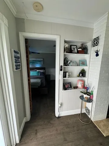 a view of a livingroom with furniture and storage