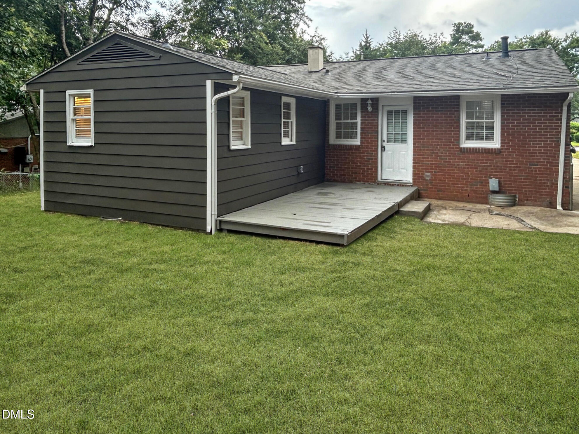 845 Newcombe Road Raleigh, NC 27610 - Photo 23 of 25 Exterior back with grass