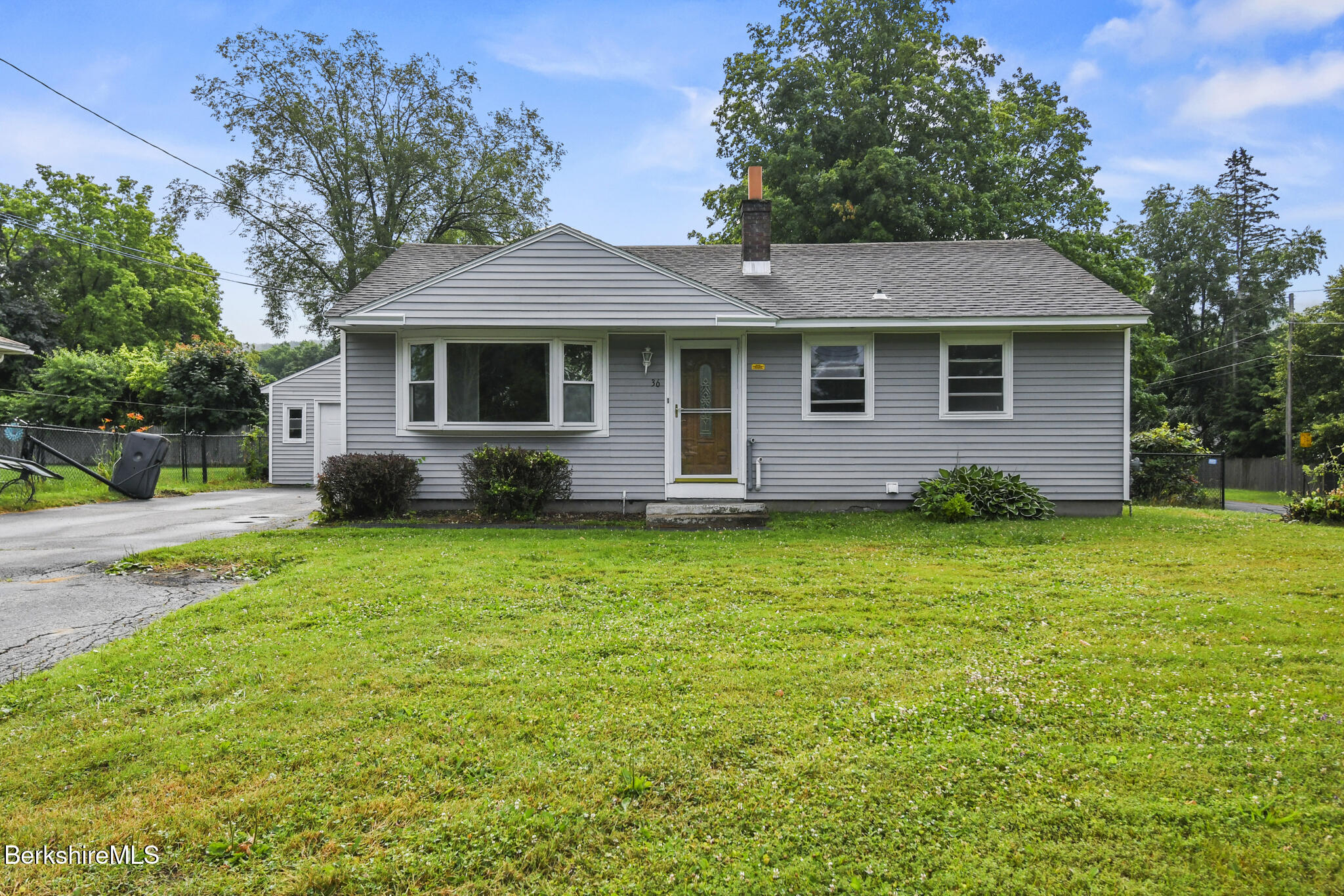 36 Dalton Division Road Dalton, MA 01226 - Photo 1 of 35 a front view of a house with a garden
