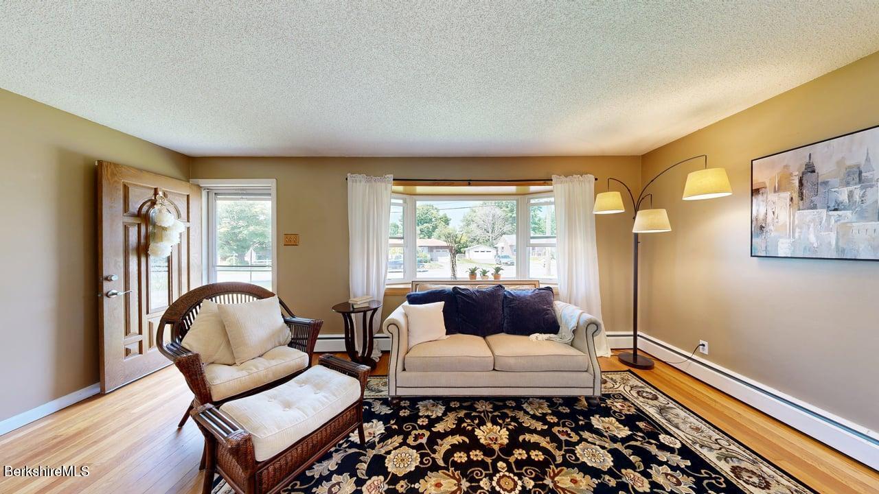 36 Dalton Division Road Dalton, MA 01226 - Photo 16 of 35 a living room with furniture and a window