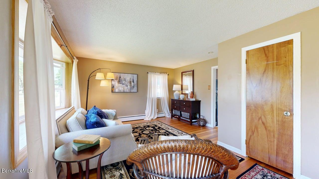 36 Dalton Division Road Dalton, MA 01226 - Photo 17 of 35 a view of a livingroom with furniture and a window