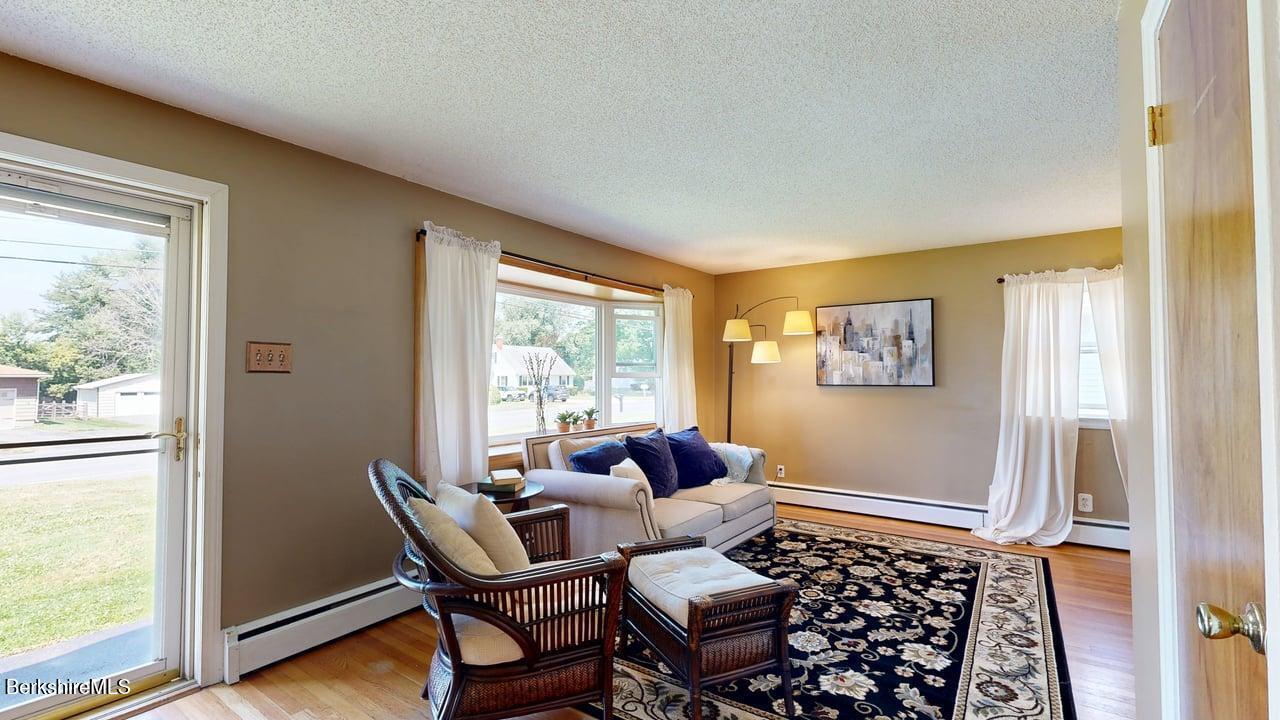 36 Dalton Division Road Dalton, MA 01226 - Photo 19 of 35 a living room with furniture and a window