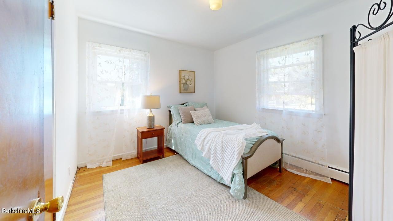 36 Dalton Division Road Dalton, MA 01226 - Photo 21 of 35 a spacious bedroom with a bed and a window