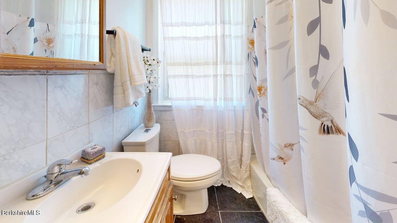 36 Dalton Division Road Dalton, MA 01226 - Photo 25 of 35 a bathroom with a sink toilet and shower