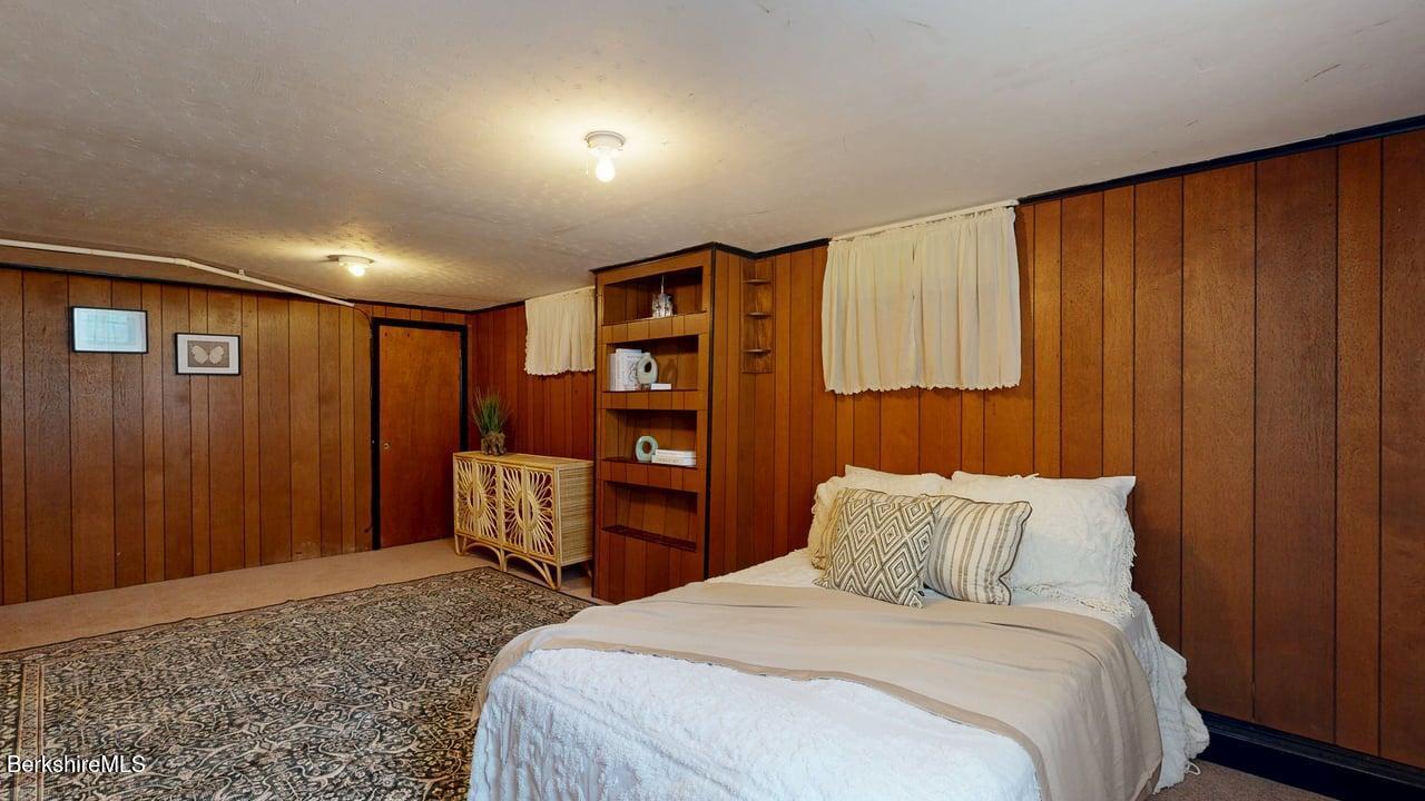 36 Dalton Division Road Dalton, MA 01226 - Photo 26 of 35 a bedroom with bed and chair