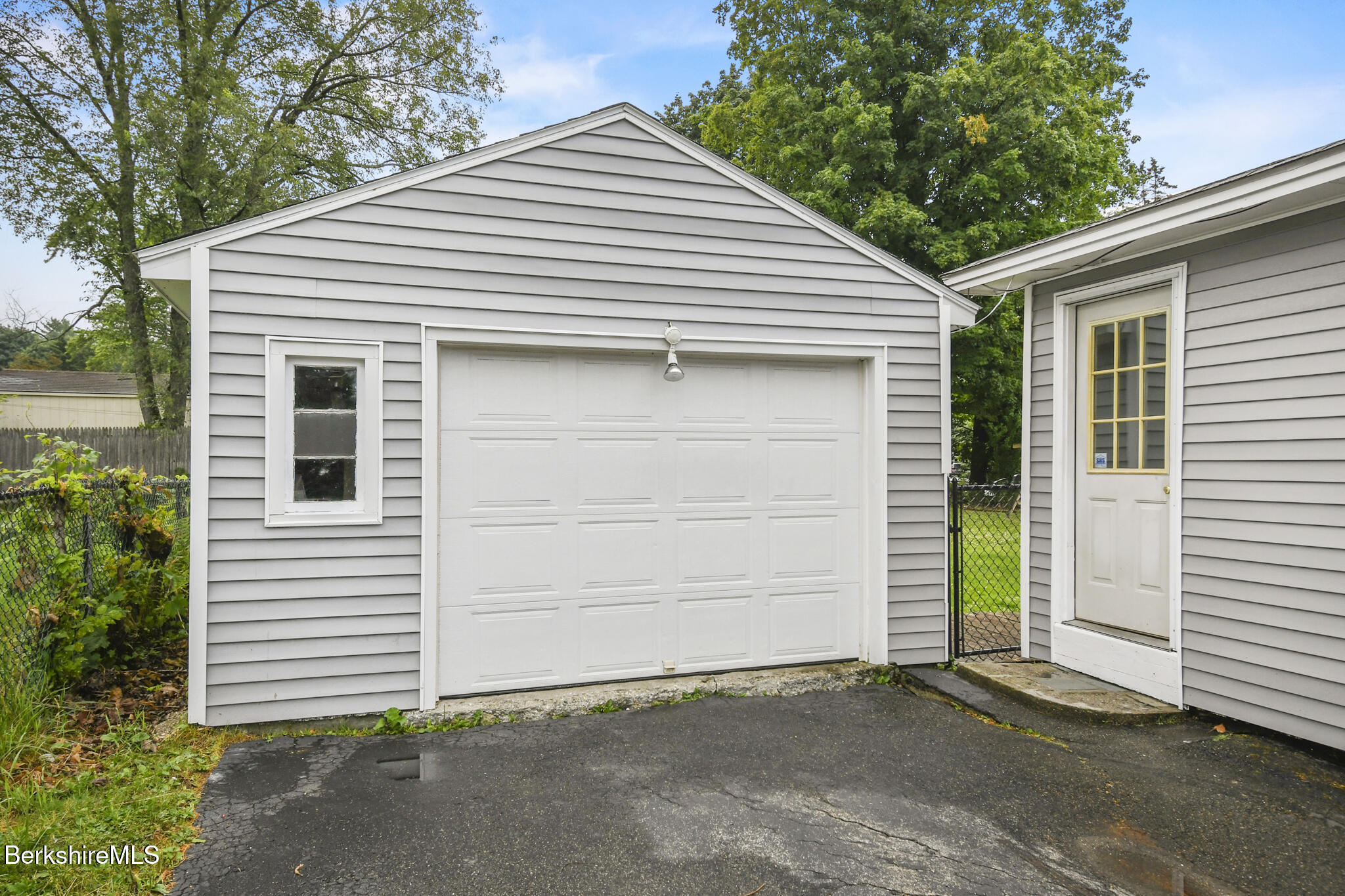 36 Dalton Division Road Dalton, MA 01226 - Photo 4 of 35 a front view of a house with a garage