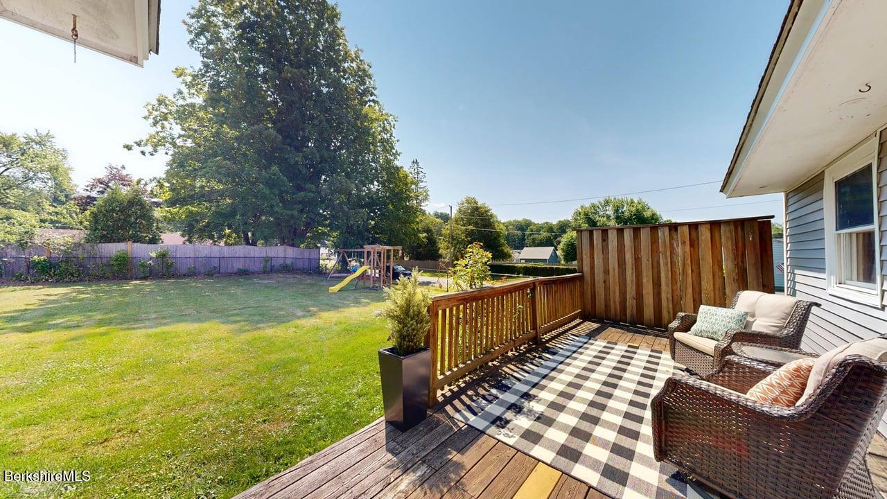36 Dalton Division Road Dalton, MA 01226 - Photo 8 of 35 a view of a patio with couches chairs and wooden floor