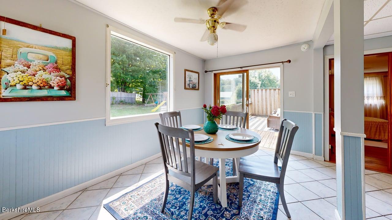 36 Dalton Division Road Dalton, MA 01226 - Photo 10 of 35 a dining room with furniture a large window and a rug