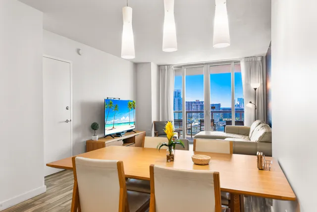 a kitchen with stainless steel appliances granite countertop a refrigerator a stove a sink and a microwave