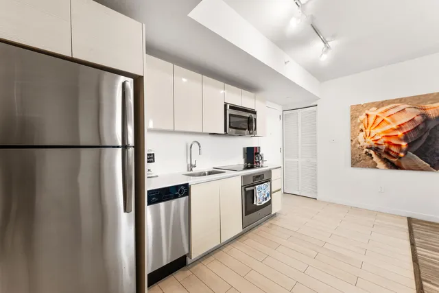 a living room with furniture fireplace and a flat screen tv