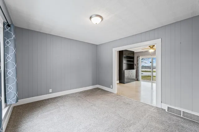 an empty room with entrance door