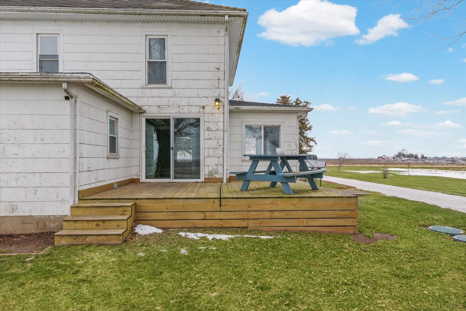 1471 East 100th Road North Rankin, IL 60960 - Photo 6 of 39 a view of a house with a backyard and a patio