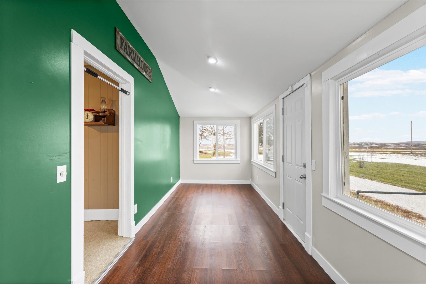 1471 East 100th Road North Rankin, IL 60960 - Photo 8 of 39 a view of a hallway with wooden floor and windows