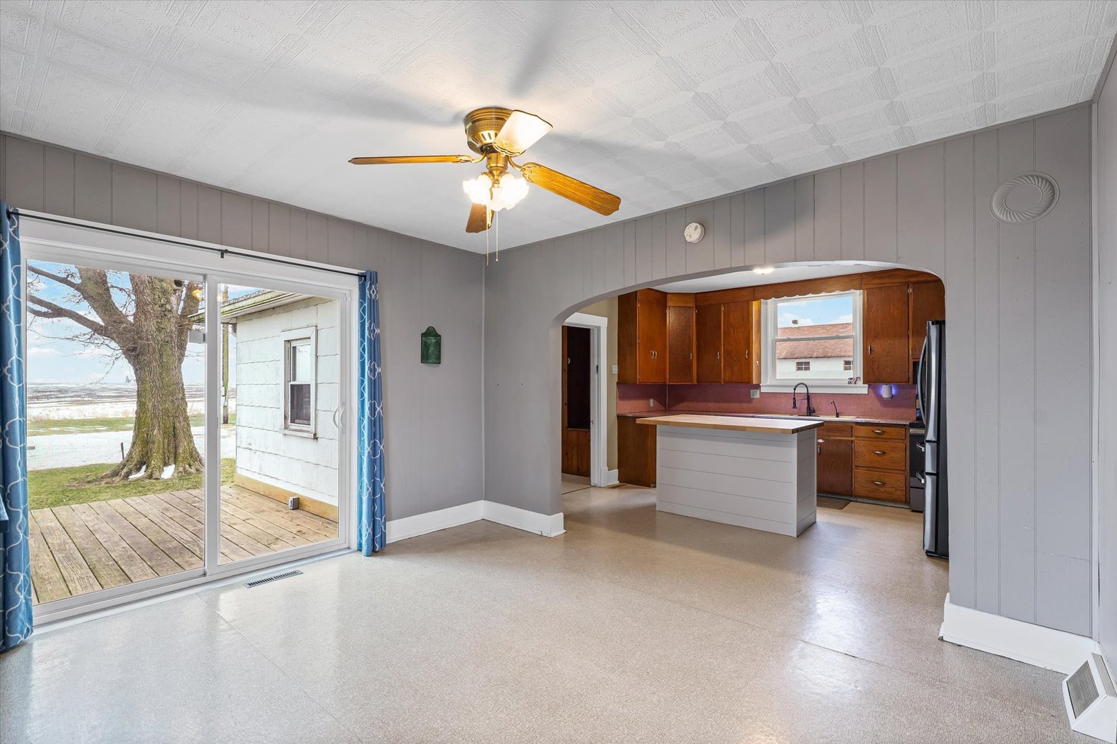 1471 East 100th Road North Rankin, IL 60960 - Photo 9 of 39 a view of an empty room and kitchen with a large window