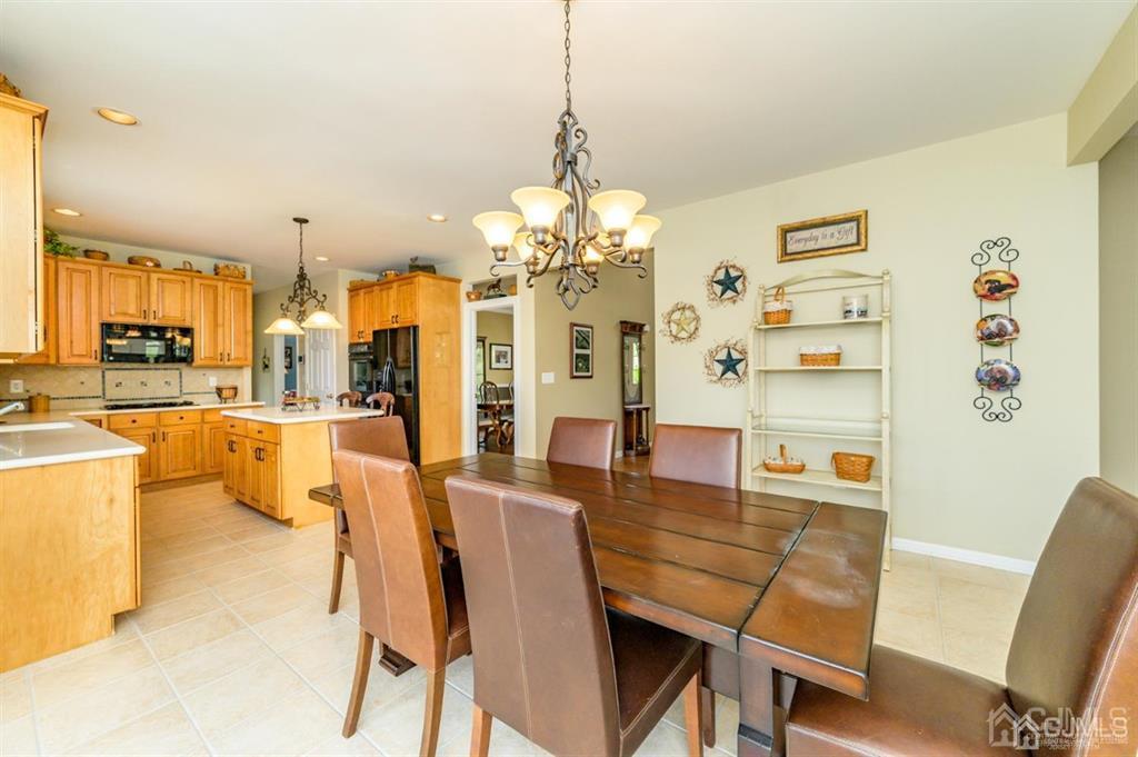 55 Rues Road Cream Ridge, NJ 08514 - Photo 17 of 67 a dining room with furniture and a chandelier