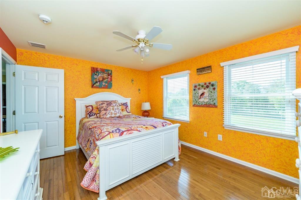 55 Rues Road Cream Ridge, NJ 08514 - Photo 35 of 67 a bedroom with a bed and wooden floor