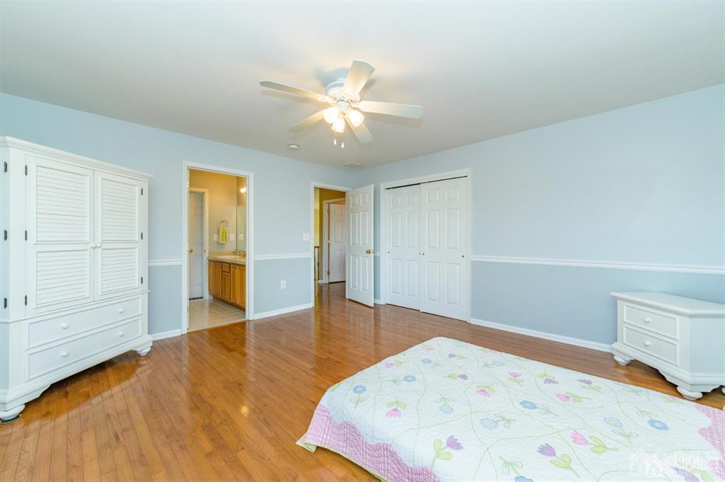 55 Rues Road Cream Ridge, NJ 08514 - Photo 39 of 67 a bedroom with a bed and cabinets