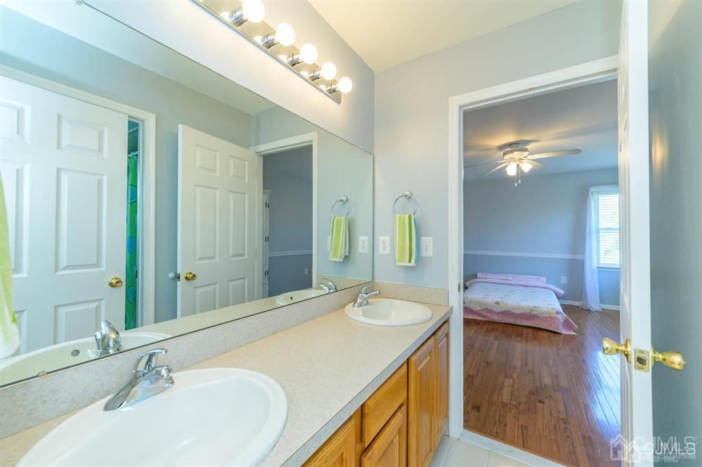 55 Rues Road Cream Ridge, NJ 08514 - Photo 40 of 67 a bathroom with a granite countertop sink and a mirror
