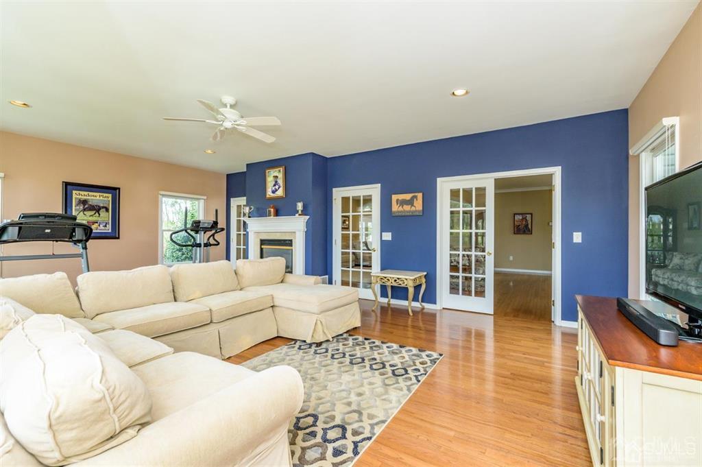 55 Rues Road Cream Ridge, NJ 08514 - Photo 8 of 67 a living room with furniture and a flat screen tv
